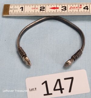 p147- .800+ Silver torque-style bangle. Silver Tested