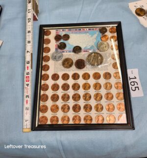 p165- United States Lincoln pennies w/ other coins on frame