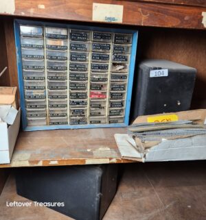 s104- contents of 2 bottom shelves