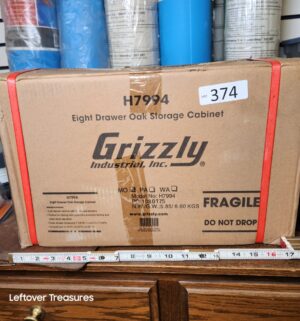s374- Grizzly 8 Drawer Oak Storage Cabinet. Sealed
