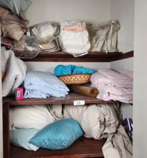 t23- all contents in the linen closet. Bedding for twin and queen