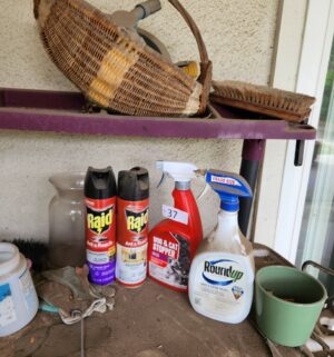 t37- bug spray, round up. 50% full, items on the garden cart