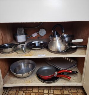 t52- cookware in the cabinet