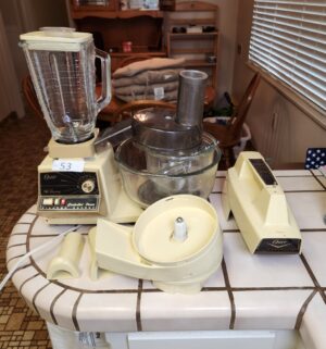 t53- vintage Oster Regency Kitchen Center, an all-in-one appliance combining a stand mixer, blender, and food processor