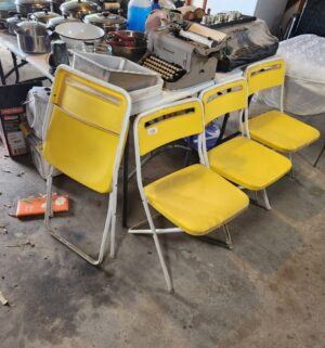 t104- vintage yellow metal folding chairs