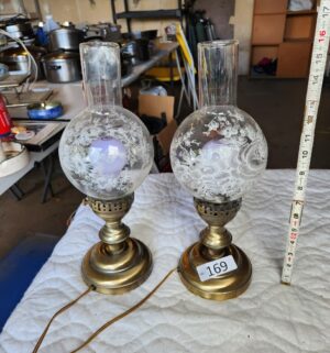 t169- vintage brass hurricane lamps with floral etched glass shades. 1 is damaged