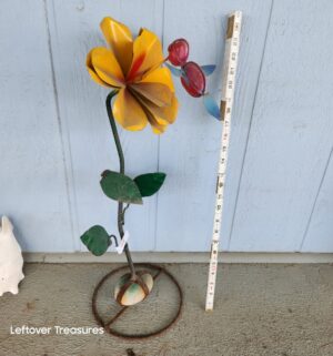 v48- hand-welded metal flower garden sculpture with a rock base