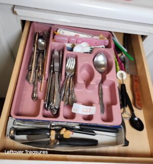 v127- contents of the under sink cabinet, and drawers