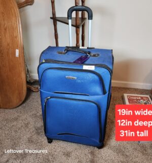 v140- very nice rolling suitcase