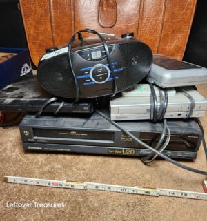 w16- DVD/VHS Players, Cd player, tape player. All power on. Stored in master closet