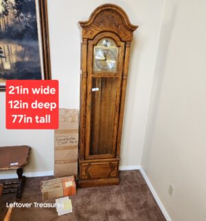 w86- Howard Miller Model 610-160 Grandfather Clock. Weight removed. Sold with paperwork. Service records and original invoice