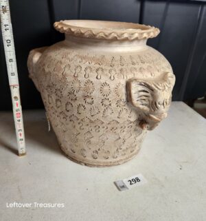w298- clay pottery vessel featuring distinctive elephant head handles