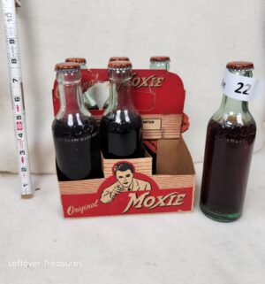 b22- vintage Moxie soda six-pack featuring a cardboard carrier with a Ted Williams graphic