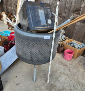 y36- washing machine drum fire pit w/ contents