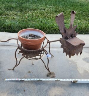y51- rusty metal dog plant holder - Image 1