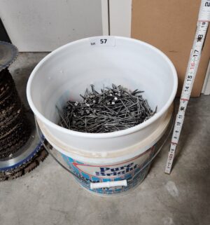 y57- half full bucket of nails - Image 1