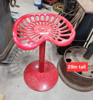 y275- Deering red metal tractor seat stool with a industrial farmhouse aesthetic - Image 1