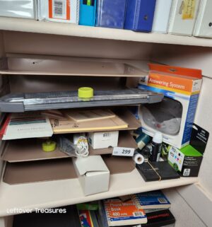 y299- office supplies on shelf - Image 1