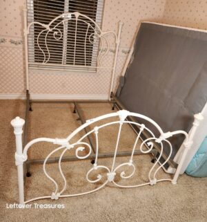y311- Queen Victorian-style white cast iron bed frame featuring ornate scrollwork - Image 1