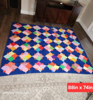 y478- vintage Jumping Jacks quilt features a vibrant patchwork design. Homemade