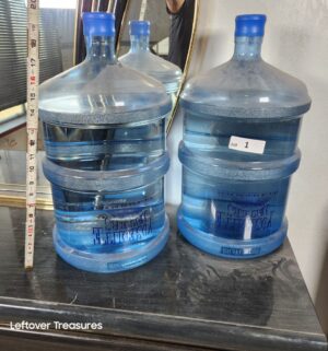 a1- Two sealed 5 gallon jugs of water