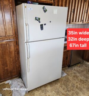 a30- large GE Refrigerator. Works great. Ice maker was working. Small rust seen on the bottom corner. Not pictured