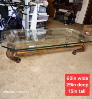 a83- Glass top coffee table. VERY HEAVY. No major chips seen - Image 1