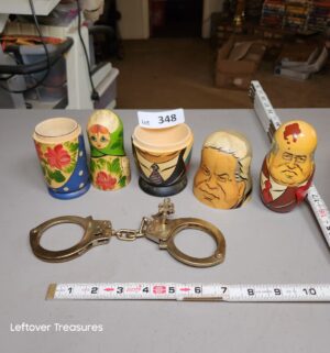 a348- handcuffs, wooden stacking toys - Image 1