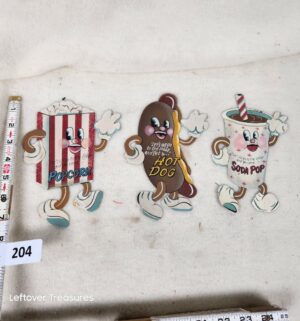 b204- set of three retro metal tin signs featuring dancing movie snacks
