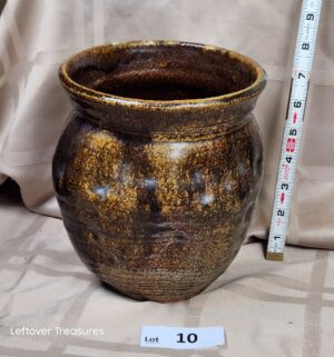 c10- resembles alkaline-glazed pottery. Signed on bottom