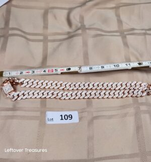 c109- iced-out Miami Cuban link chain. Fake stones not gold or silver.