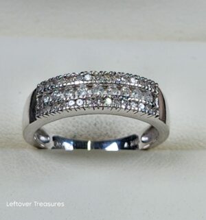 c153- 14K white gold wedding band featuring three rows of round-cut diamonds. Gold & Diamonds Tested