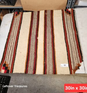 d82- handwoven striped Navajo style rug, likely used as a saddle blanket