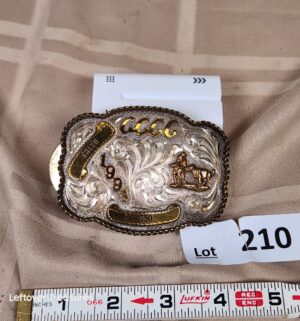d210- silver and gold-toned rodeo belt buckle