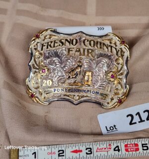 d212- Fresno County Fair belt buckle features a 2011 Pony Champion title